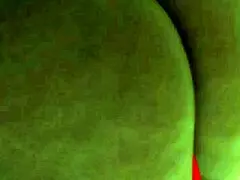 An ebony woman is enjoying some personal time with toys in lingerie