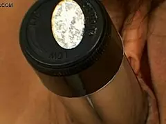 Mature mommy plays with toys in solo session