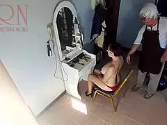 Hidden camera catches hairdresser undressing lady for a nude haircut at barbershop