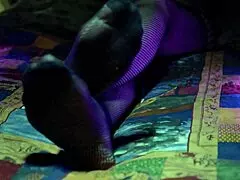 Perfect toes peek through sexy fishnets on a milf housewife