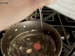 Stepmom secretly blows stepson in the kitchen.