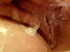 Watch my 50-plus wife wash her natural tits and pussy in the bath?