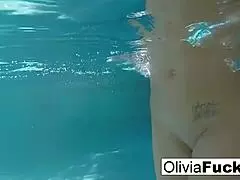 olivia splashes around in the pool with a big smile 😊