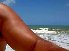 filming an alpha stud pounding and finishing on a public beach