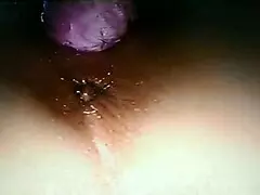 Blindfolded wife using rabbit toy