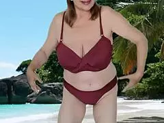 Hot granny with huge tits teasing in a stunning bikini for fans