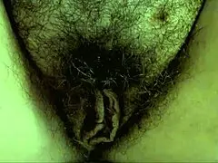 tua madre opens her hairy slit in slow motion to show pee