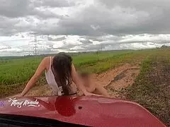 couple enjoys outdoor moment with passing cars