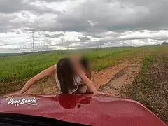 couple enjoys outdoor moment with passing cars