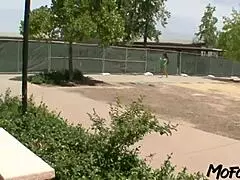 latina college graduate enjoys a playful game with a friend after graduation