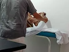 the doctor gives special attention and sensual massage to his female patient