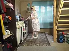 Juicy milf performs a seductive striptease in stunning lingerie and stockings.