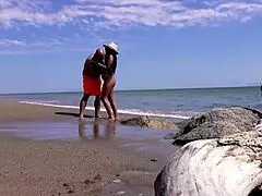 Real mature couple enjoys risky outdoor activities at public beach during holiday in mexico.