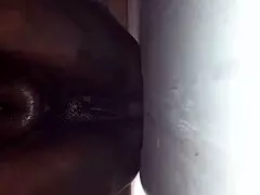 Ebony milf with big tits gets titty fucked in the backroom.