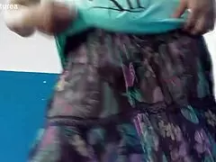 Hairy mature flashes assets in sheer outdoor dress.