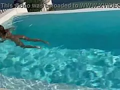 Monika Fox swims naked in the pool, her big tits exposed