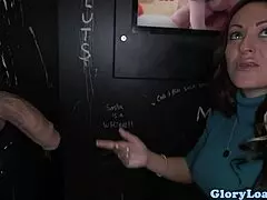 milf gags on big black cock at gloryhole