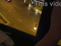 Petite babe masturbates openly by hotel window for all to see.