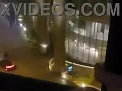 Petite babe masturbates openly by hotel window for all to see.