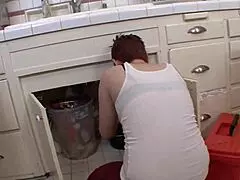 Lesbian mom enjoying time with red-haired girl in a casual setting.