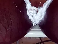 Black milf shaves her wet pussy with toys and tattoos on display