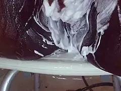 Black milf shaves her wet pussy with toys and tattoos on display