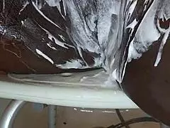 Black milf shaves her wet pussy with toys and tattoos on display