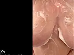 French Round Milf Caresses Her Big Tits In Secret Shower. Voyeur captures the chubby mature bathing.