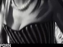 Elegant brunette milf endures intense threesome fucking in corset and glasses.