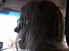 Licking the pussy of a slutty mom in fishnets on bed.