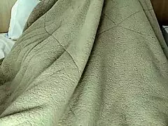 boy eats tasty aunt under blanket in bedroom