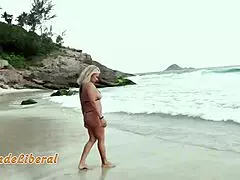 blonde milf in micro bikini sucks stranger's dick on beach