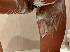 the stepsister is seen naked in the shower during her daily bathing routine at home