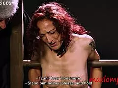 Redhead milf screams in pain from caning her tits