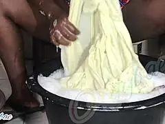 as a dedicated housewife, i tackle the weekend laundry routine, folding clothes neatly in our cozy home.