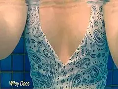 I watch my wife swim in the hotel pool.