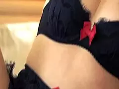 Enchanting woman in lingerie touches her wet pussy softly.