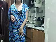 The indian stepmom feels so aroused watching her stepson, then enters the kitchen to fuck him passionately