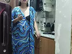 The indian stepmom feels so aroused watching her stepson, then enters the kitchen to fuck him passionately
