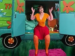 Granny Velma reaches orgasm from fingering and tongue fucking in costumes.
