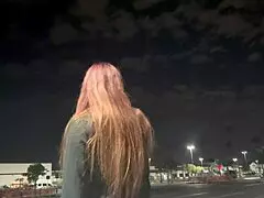 Artemisia Love smokes outdoors in Los Angeles at night