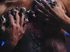 Girl gets messy with food on birthday cake