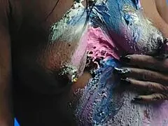 Girl gets messy with food on birthday cake