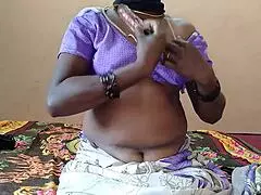 Girl relaxes on bed with a vibrator for some self-care.