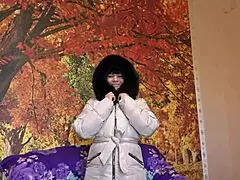 Milf sucks big dildo in fur-trimmed coat