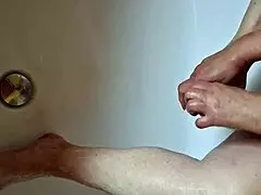 Washing dirty feet in the bathtub at home