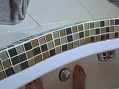 Washing dirty feet in the bathtub at home