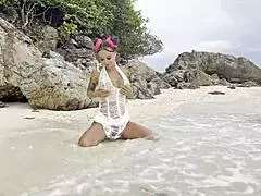 Monika Fox fucks pussy with big dildo on beach