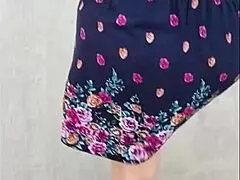 Following this mature woman in her skirt and thong on the street