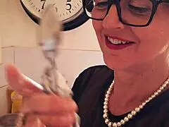 Karina, the innocent housewife, awaits in the kitchen ready for anything.